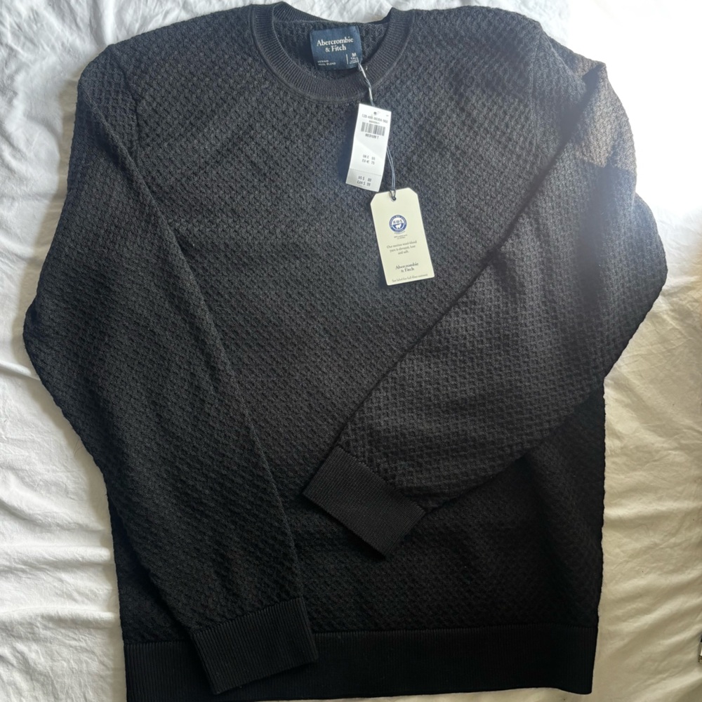 black men’s sweater with tags